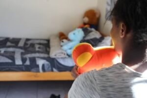 Child in her room at the shelter Child in her room at the shelter